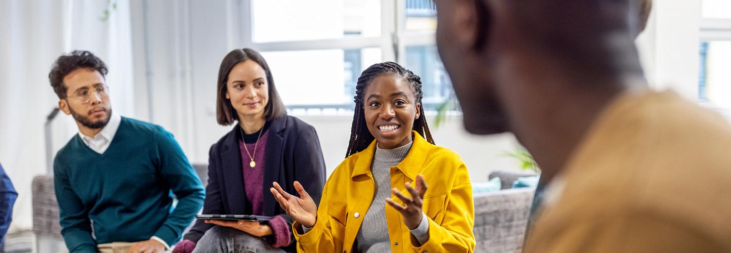 a young woman shares her opinion during a meeting