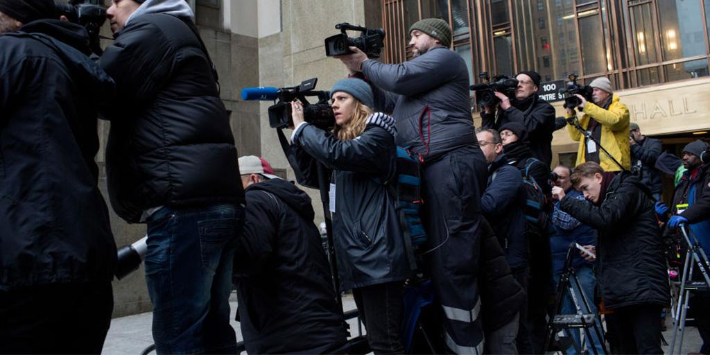 news media outside of a courthouse