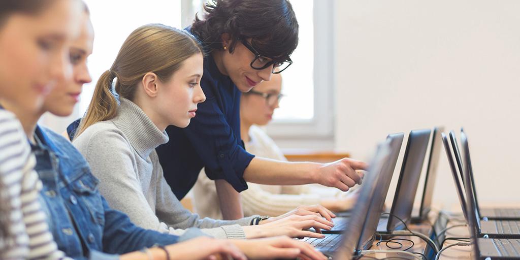 a young woman learning computer coding